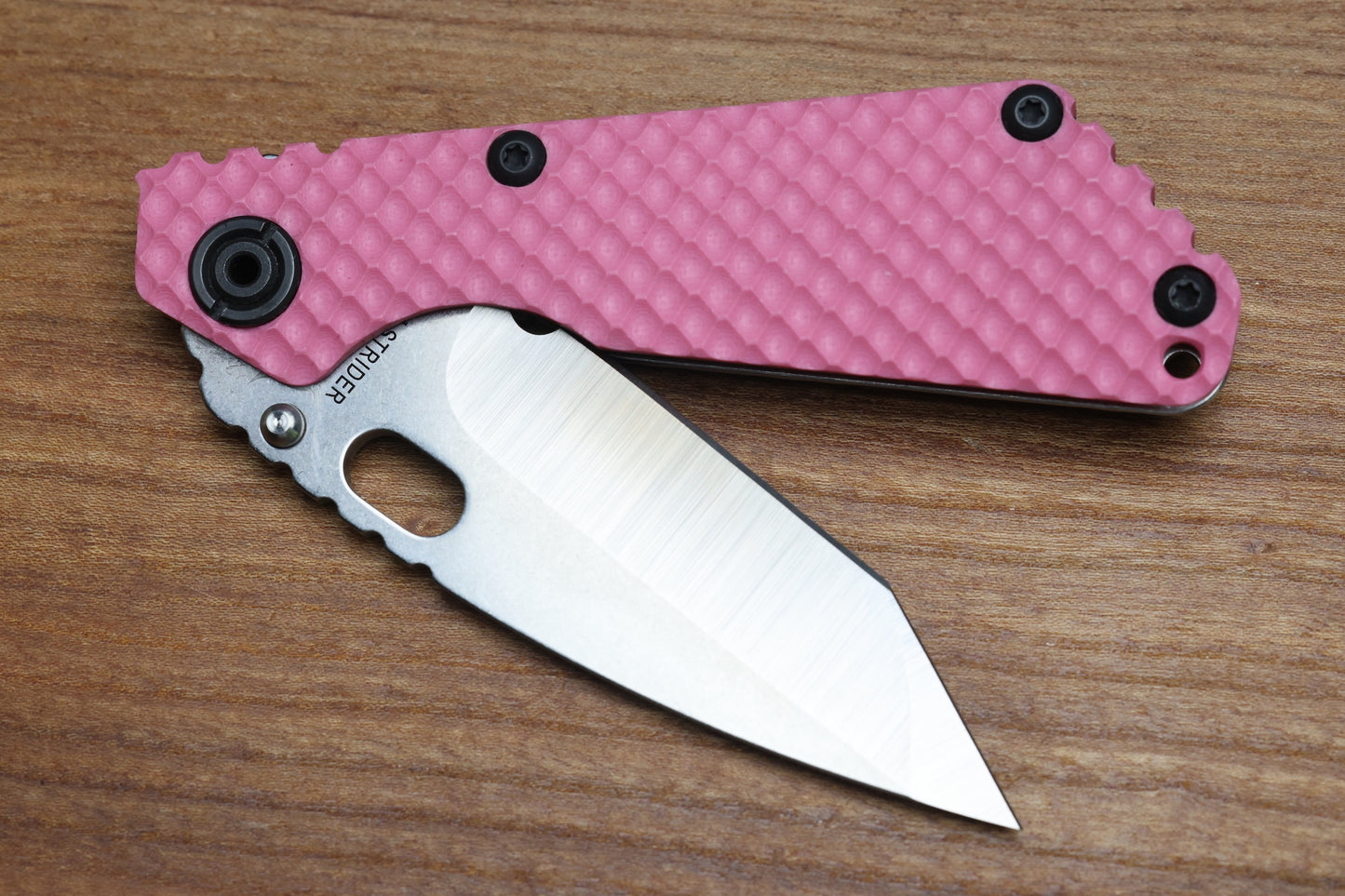 STRIDER KNIVES SNG TWO-TONE SATIN/ STONEWASHED MAGNACUT TANTO BLADE, PINK G10 GUNNER GRIP TOP, STONEWASHED GUNNER GRIP TITANIUM FRAME
