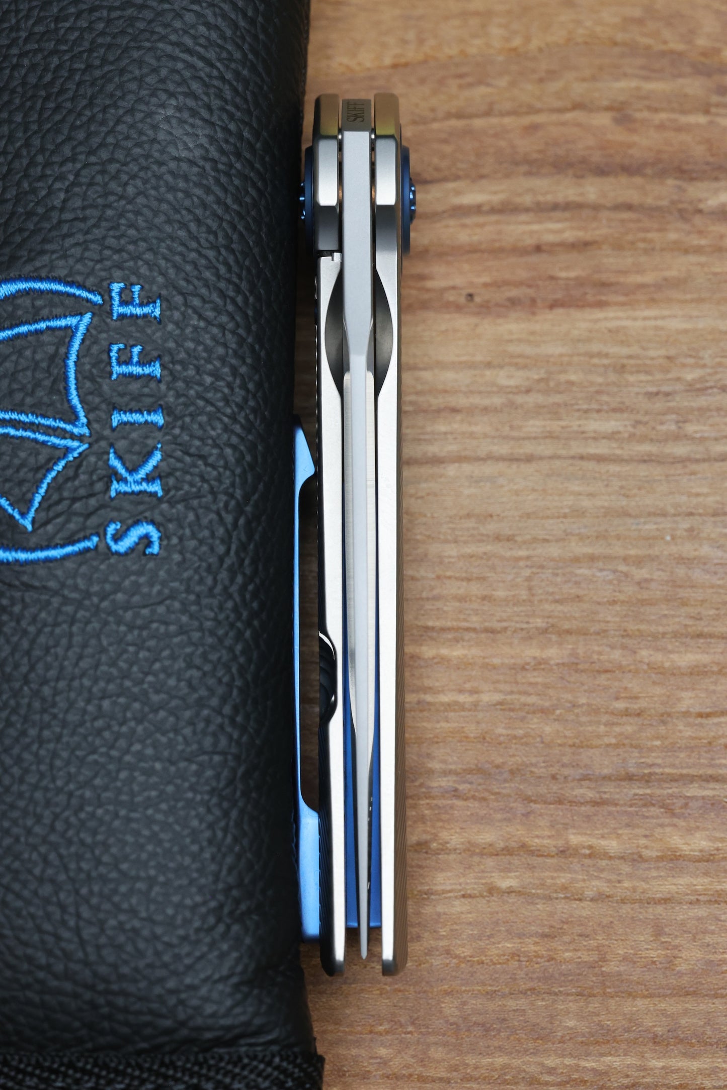 SKIFF MADE BLADES FUGITIVE- CPM154 BLADE, MILLED TITANIUM SCALES, ROYAL BLUE TI BACKSPACER, PIVOT COLLAR AND CLIP, #195