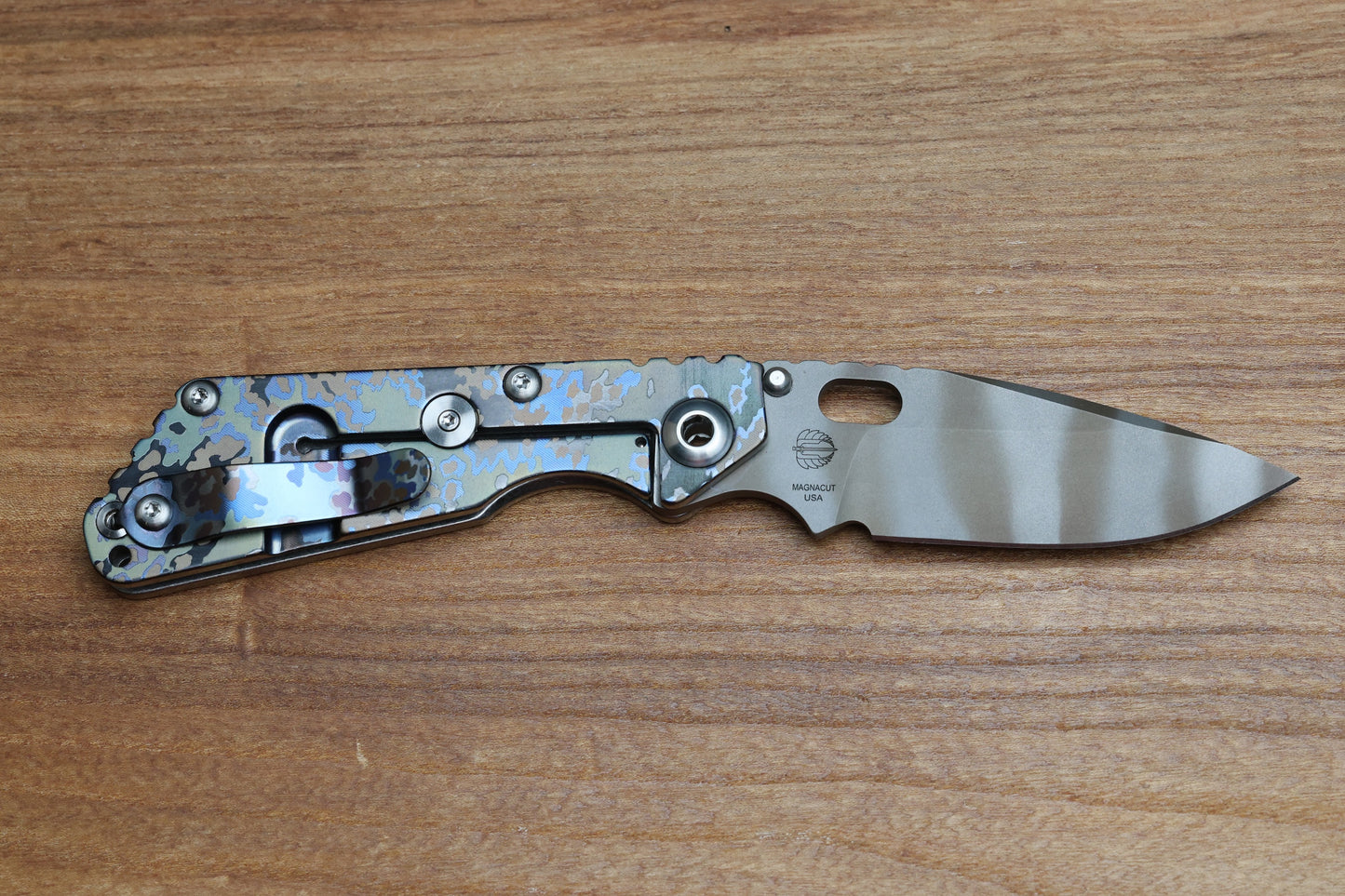 STRIDER KNIVES SNG PARTIZAN CAMO TITANIUM HANDLE W/PARTIZAN CAMO CLIP-TIGER STRIPE MAGNACUT DROP POINT BLADE,