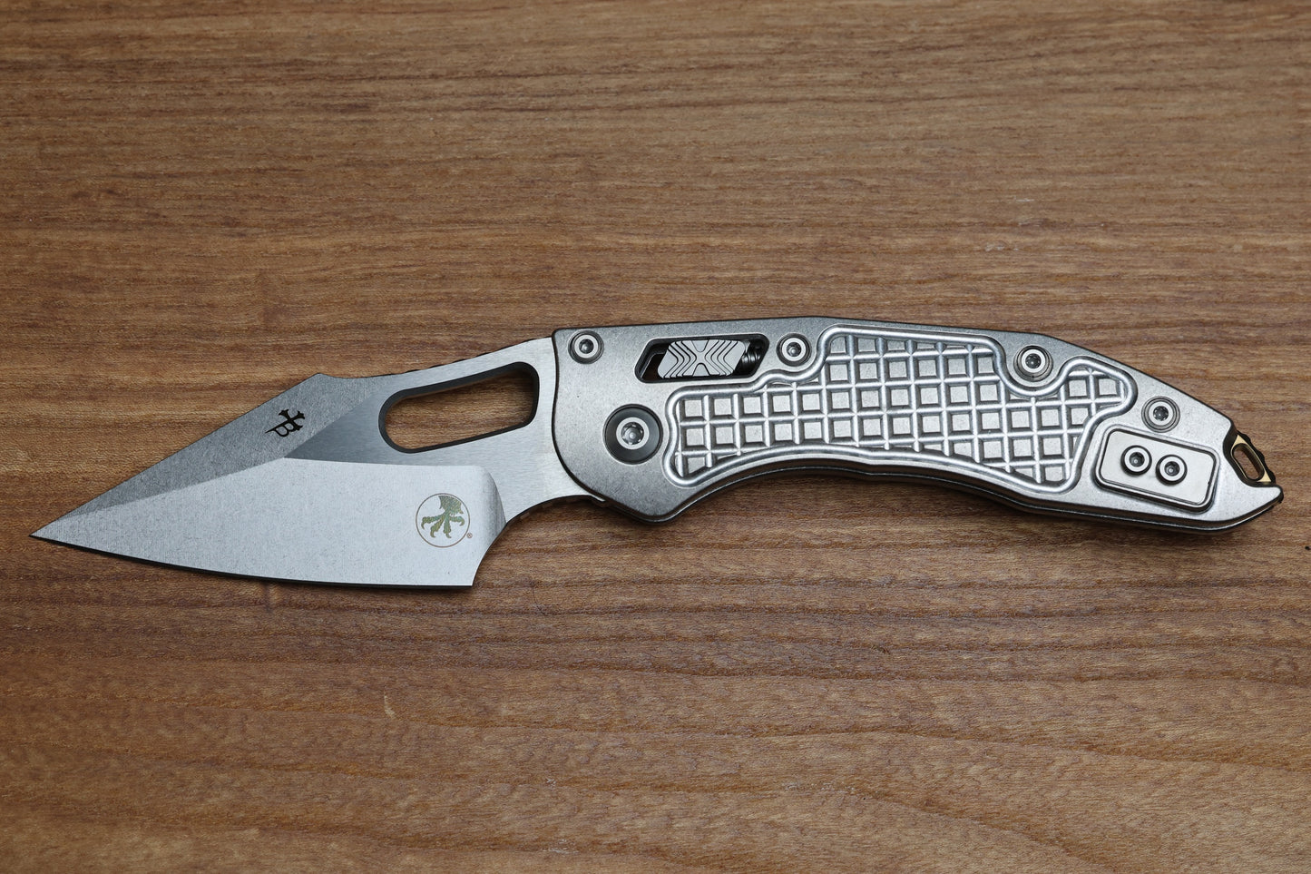 MICROTECH MARFIONE SELECT MANUAL STITCH RAM LOK FRAG TITANIUM HANDLES & STONEWASH M390MK W/ DOUBLE VAPOR BLAST & BRONZE ACCENTS 169RL-10FRMS1