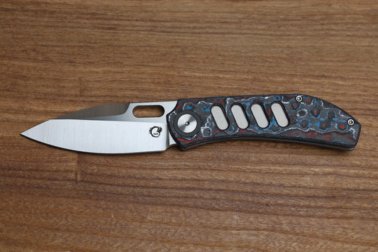 YAN’S CHEVRON- TITANIUM FRONT FLIPPER WITH NEBULA CF THUMB HOLE