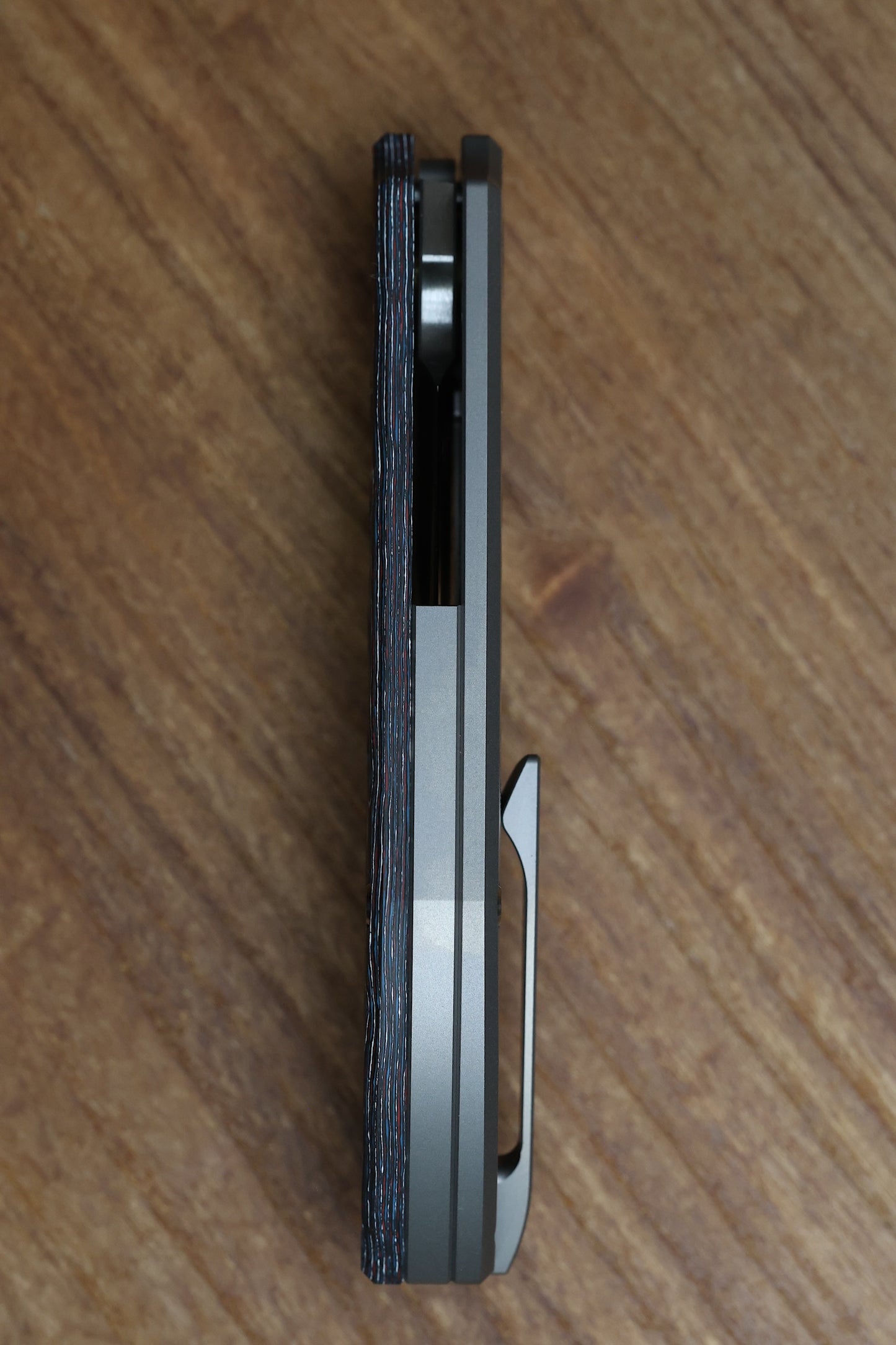 YAN’S CHEVRON- TITANIUM FRONT FLIPPER WITH NEBULA CF THUMB HOLE