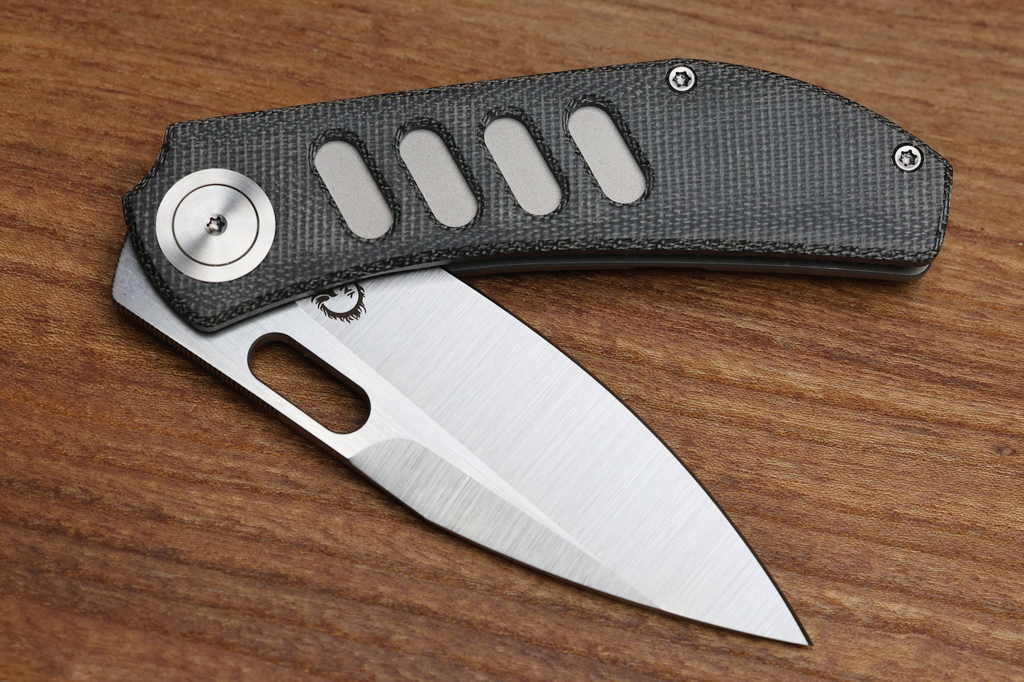 YAN’S CHEVRON- TITANIUM FRONT FLIPPER WITH BLACK MICARTA THUMB HOLE