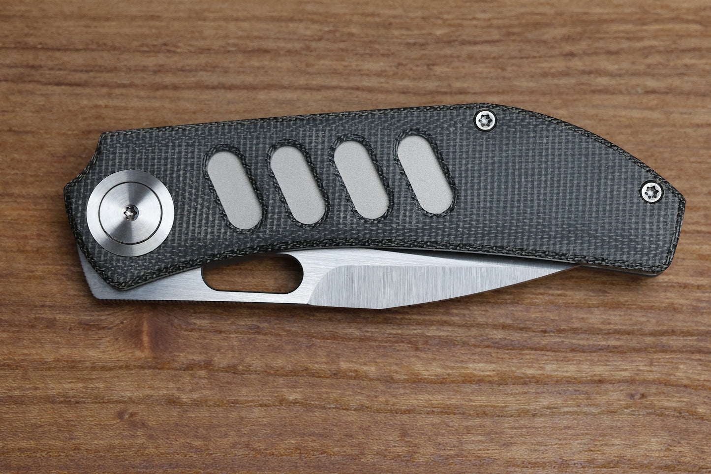 YAN’S CHEVRON- TITANIUM FRONT FLIPPER WITH BLACK MICARTA THUMB HOLE