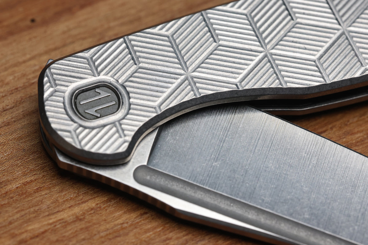 BROWN KNIVES CORTEX XL MILLED PATTERN TITANIUM AND HOLLOW GROUND SATIN MAGNACUT BLADE #414 (PREOWNED)