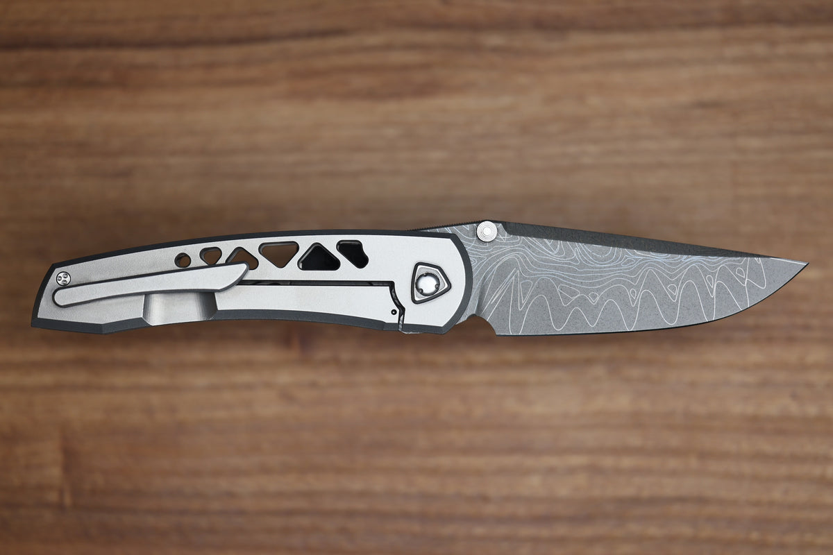 SHARKNIVCO WAKA DIAMOND BLAST TITANIUM FRAMELOCK HOLEY PATTERN RWL34 LASER ETCHED BLADE (PREOWNED)