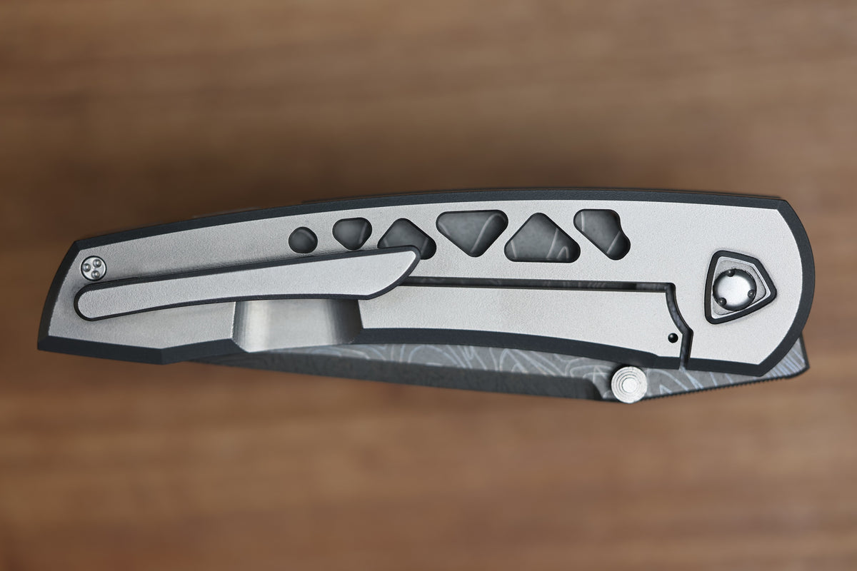 SHARKNIVCO WAKA DIAMOND BLAST TITANIUM FRAMELOCK HOLEY PATTERN RWL34 LASER ETCHED BLADE (PREOWNED)
