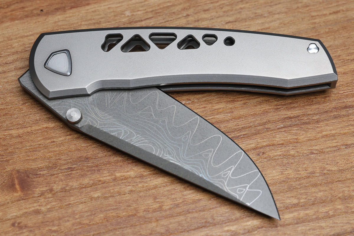 SHARKNIVCO WAKA DIAMOND BLAST TITANIUM FRAMELOCK HOLEY PATTERN RWL34 LASER ETCHED BLADE (PREOWNED)