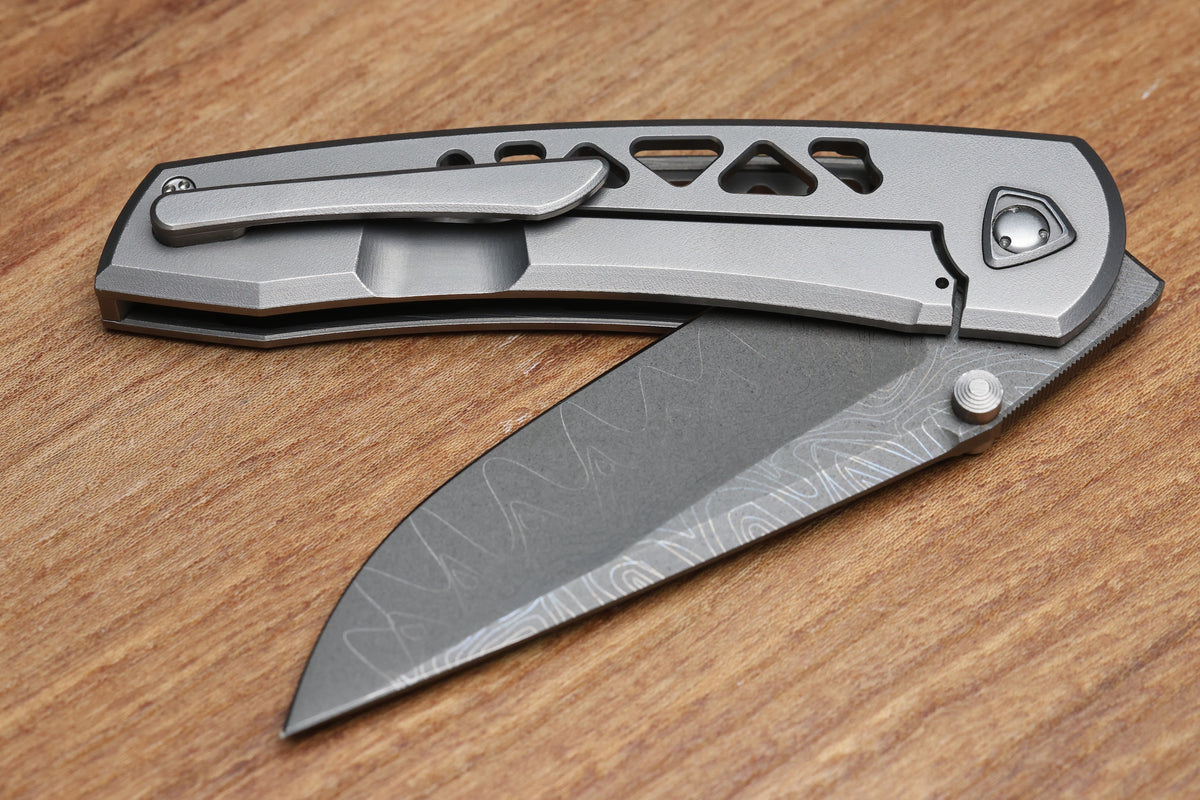 SHARKNIVCO WAKA DIAMOND BLAST TITANIUM FRAMELOCK HOLEY PATTERN RWL34 LASER ETCHED BLADE (PREOWNED)