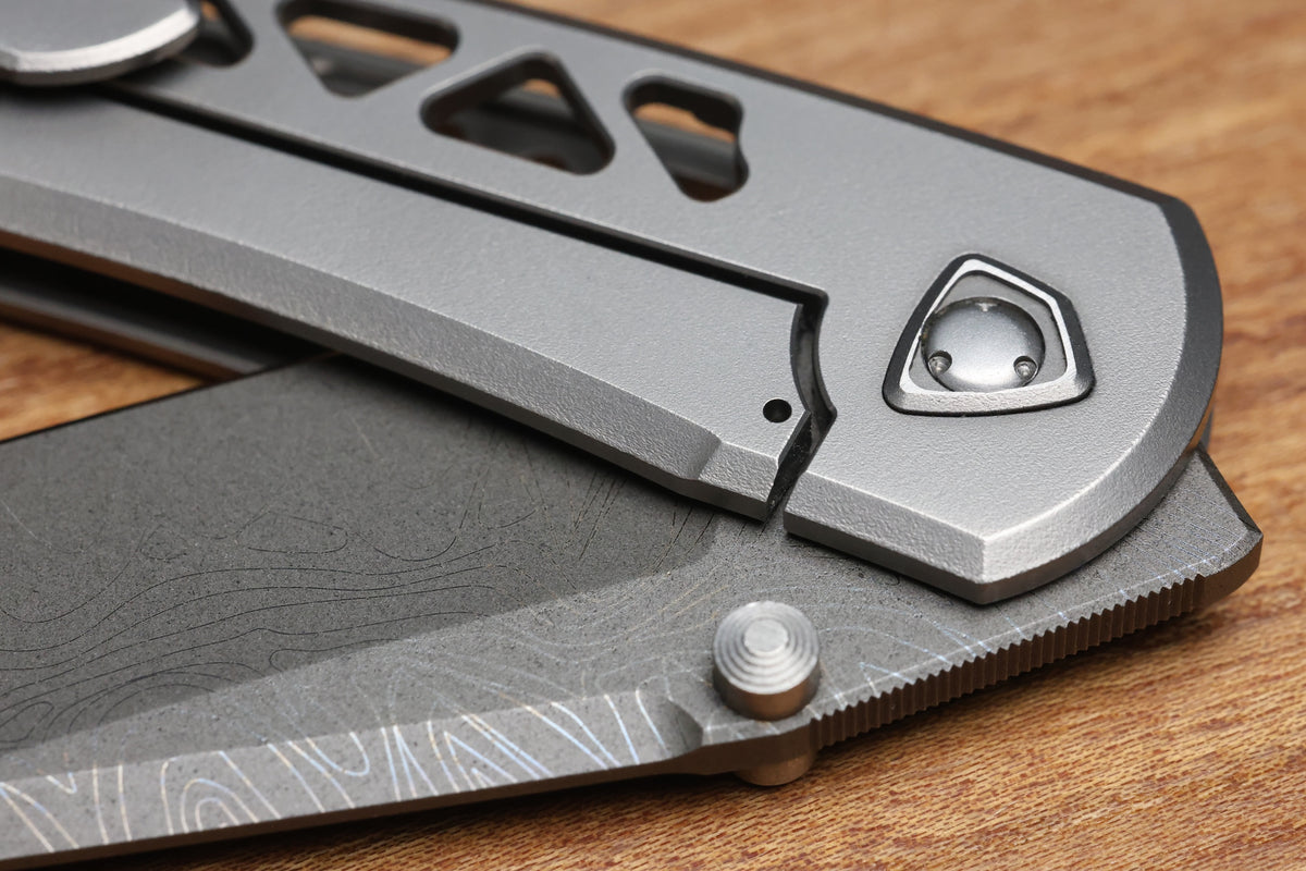 SHARKNIVCO WAKA DIAMOND BLAST TITANIUM FRAMELOCK HOLEY PATTERN RWL34 LASER ETCHED BLADE (PREOWNED)