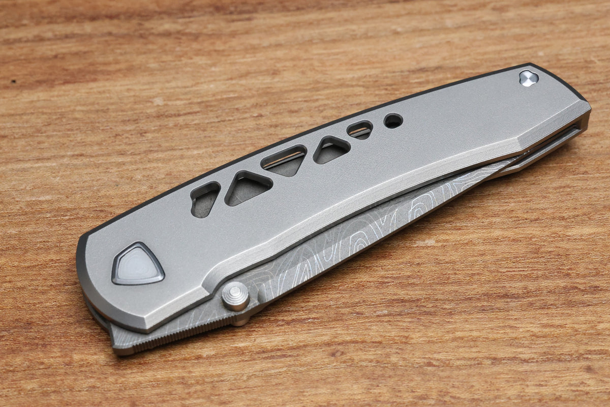 SHARKNIVCO WAKA DIAMOND BLAST TITANIUM FRAMELOCK HOLEY PATTERN RWL34 LASER ETCHED BLADE (PREOWNED)