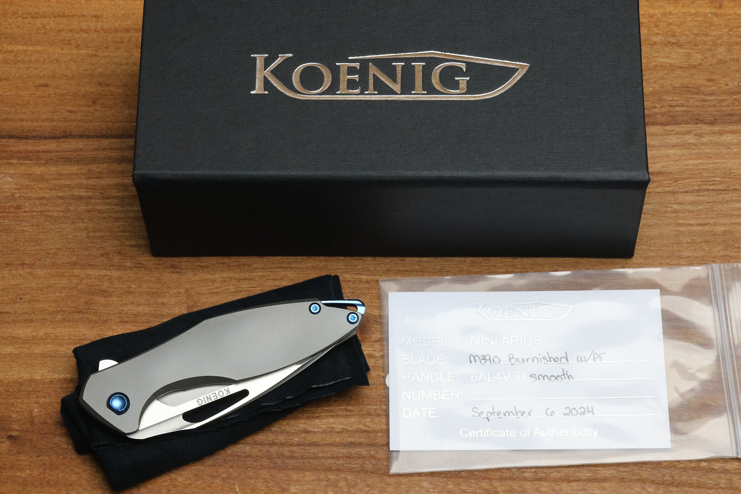 KOENIG MINI ARIUS - SMOOTH TITANIUM HANDLE - BLUE HARDWARE - BURNISHED W/ POLISHED FLATS M390 BLADE