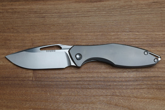KOENIG KNIVES ARIUS - NON FLIPPER - SMOOTH TITANIUM HANDLE - SILVER HARDWARE - BURNISHED W/ POLISHED FLATS M390 BLADE