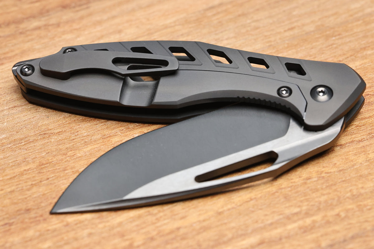 KOENIG MINI ARIUS - DLC OSSEUS 2.0 TITANIUM HANDLE - DLC HARDWARE - DLC BURNISHED W/ POLISHED FLATS M390 BLADE