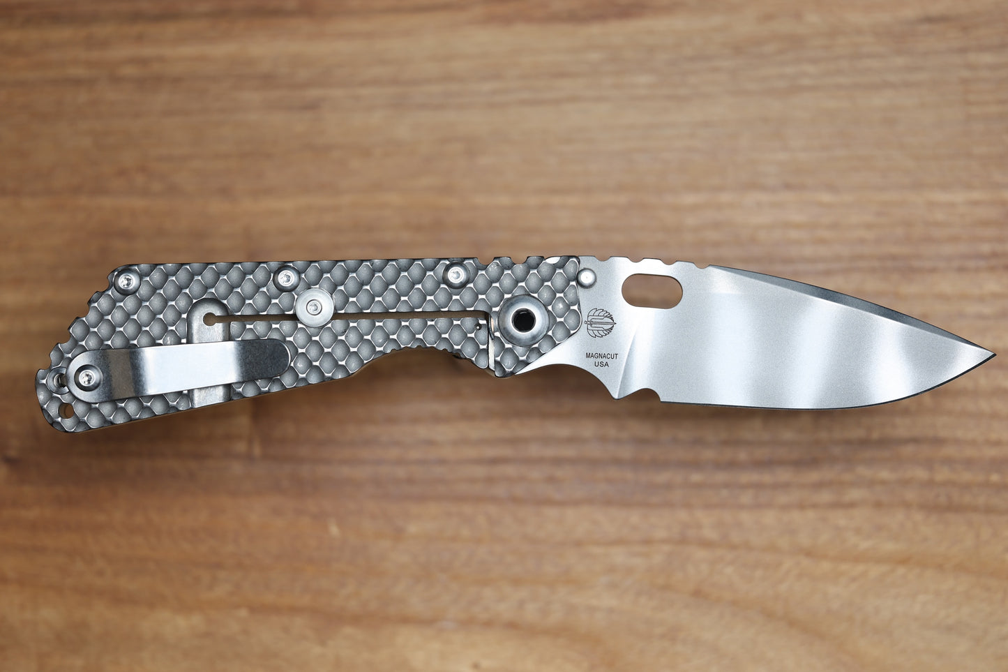 STRIDER KNIVES SMF DGG - TITANIUM/COYOTE TAN G10 HANDLE - DROP POINT MAGNACUT BLADE