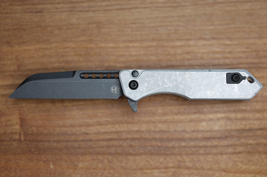 HERETIC KNIVES M/A JINN FLIPPER W/ BLIZZARDWORN ALUMINUM HANDLES & BATTLE BLACK MAGNACUT H213-8A-BLZ