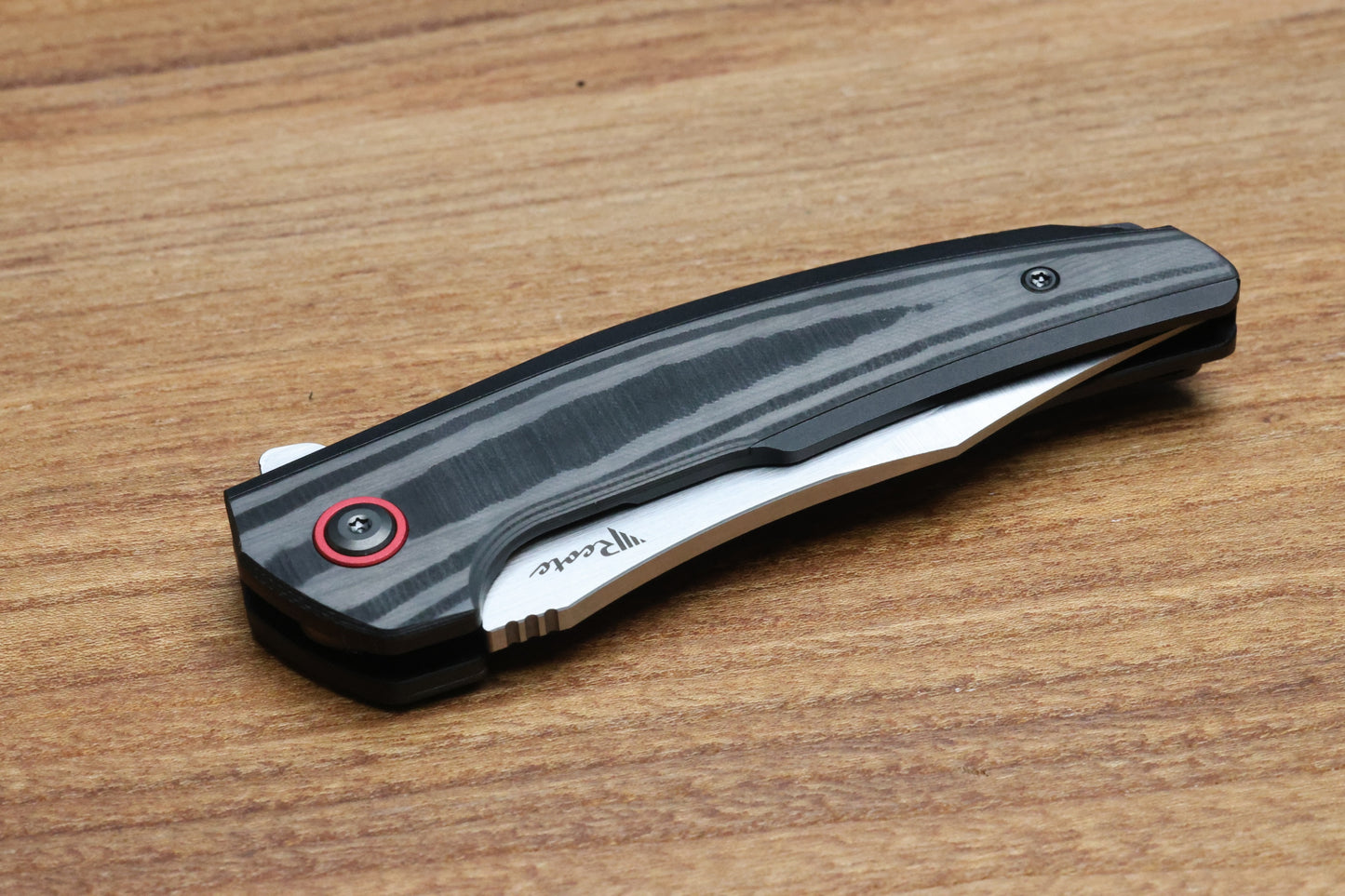 REATE KNIVES JACK JR. BLACK ALUMINUM INTEGRAL HANDLE W/ CARBON FIBER INLAY & RED PIVOT COLLAR & SATIN S30V
