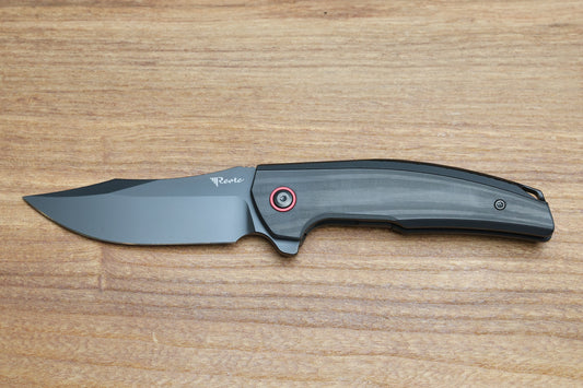 REATE KNIVES JACK JR. BLACK ALUMINUM INTEGRAL HANDLE W/ CARBON FIBER INLAY & RED PIVOT COLLAR & DLC S30V