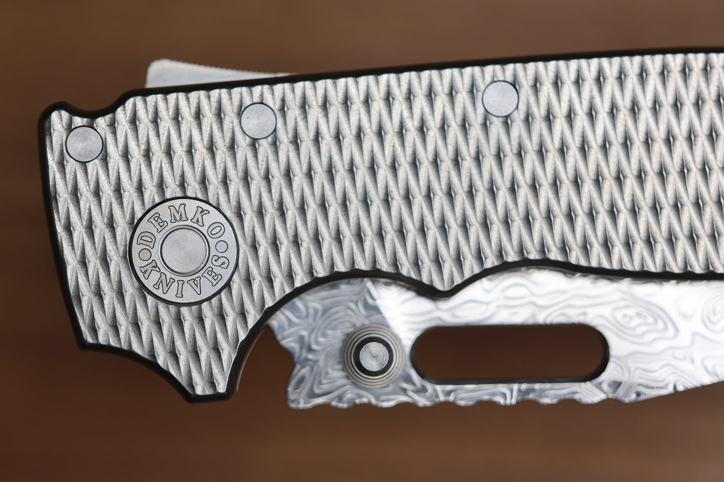 DEMKO KNIVES AD20I SLIM W/ TEXTURED TITANIUM HANDLES & POLISHED YGGDRASIL DAMASTEEL