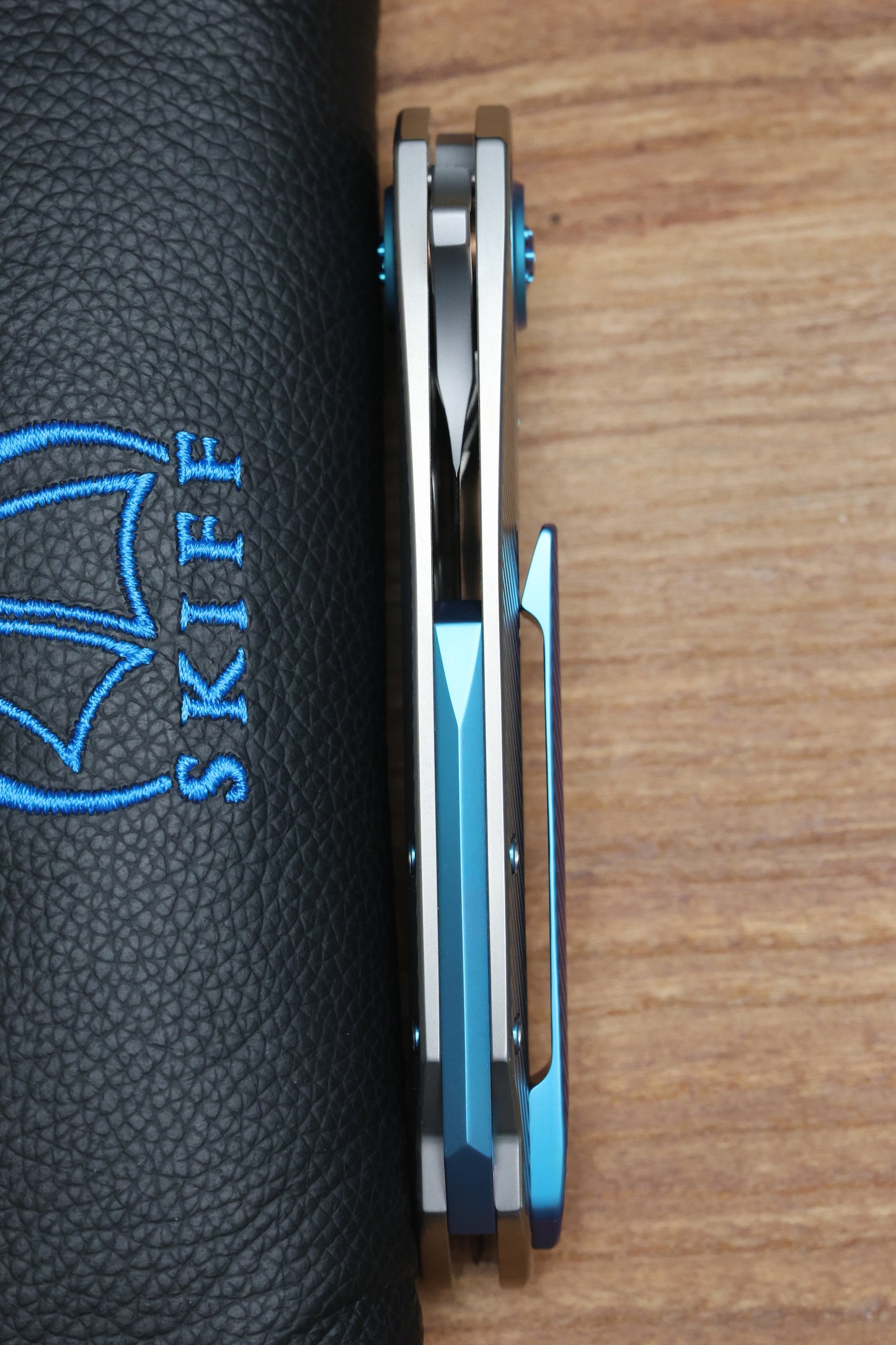 SKIFF MADE BLADES FUGITIVE- CPM154 BLADE, MILLED TITANIUM SCALES, SEA FOAM TI BACKSPACER, PIVOT COLLAR AND CLIP, #201