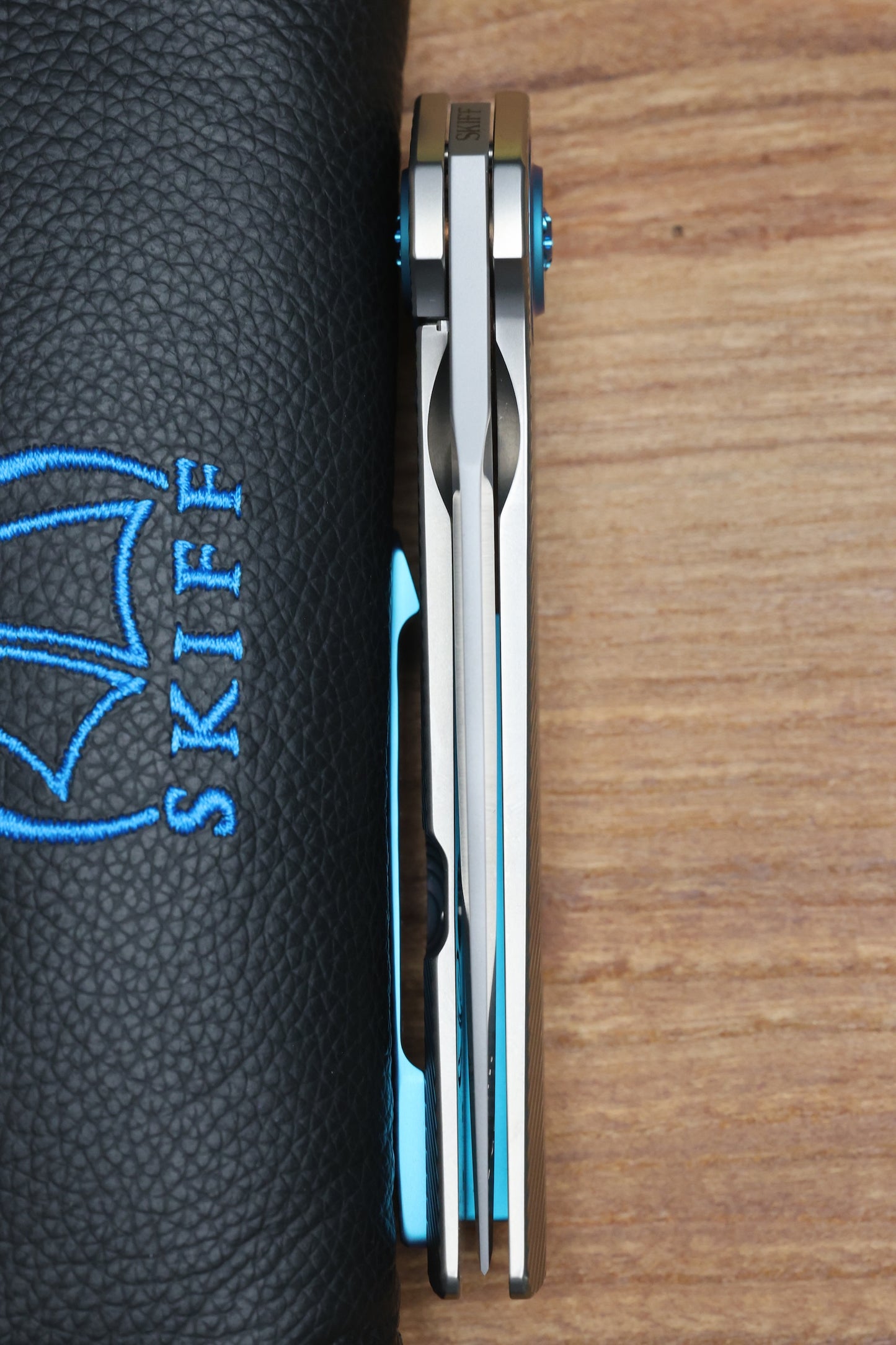SKIFF MADE BLADES FUGITIVE- CPM154 BLADE, MILLED TITANIUM SCALES, SEA FOAM TI BACKSPACER, PIVOT COLLAR AND CLIP, #201