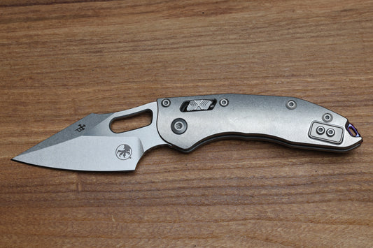 MICROTECH MARFIONE SELECT MANUAL STITCH RAM LOK TITANIUM HANDLES & STONEWASH M390MK W/ DOUBLE VAPOR BLAST & PURPLE ACCENTS 169RL-10MS3