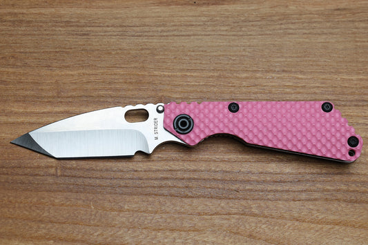 STRIDER KNIVES SNG TWO-TONE SATIN/ STONEWASHED S30V TANTO BLADE, PINK G10 GUNNER GRIP TOP, STONEWASHED GUNNER GRIP TITANIUM