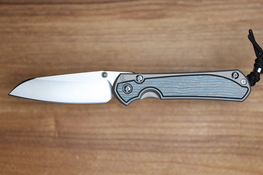 CHRIS REEVE LARGE SEBENZA 31 - OCEAN BLUE CARBOTI INLAY - INSINGO CPM MAGNACUT BLADE - MIM CLIP - SILVER DOUBLE THUMB LUGS